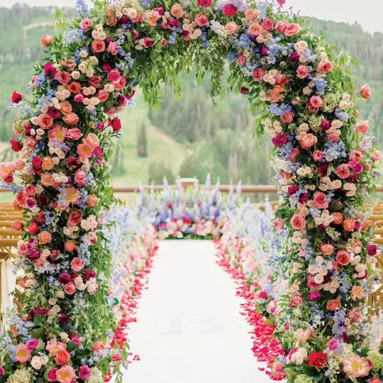 Luxury wedding design and styling with burgundy roses and crystal chandeliers in Dubai